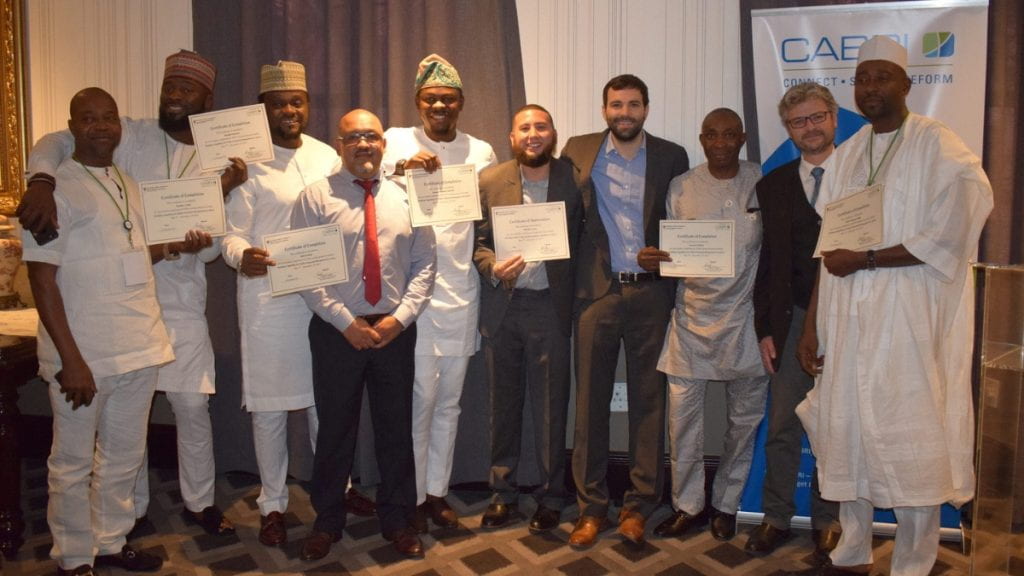 CABRI participants posing with Matt Andrews and Tim McNaught and holding certificates