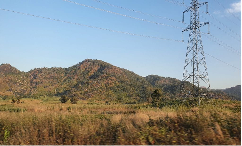 Mountains, fields, and power lines in Jos