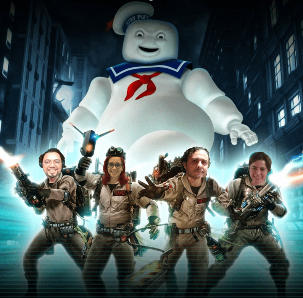Decorative: Marshmellow monster behind group members in ghostbusters outfits