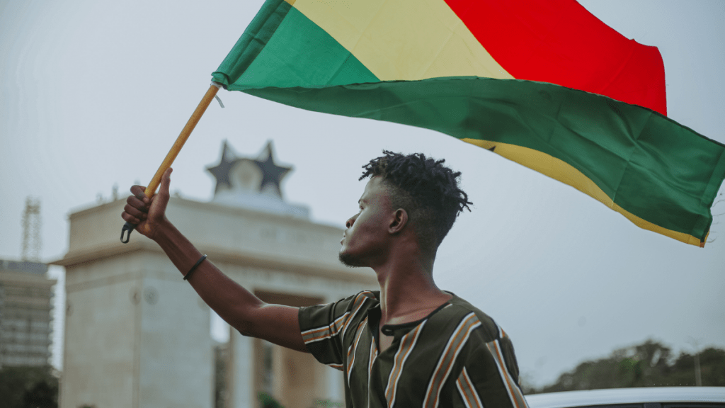 Young man holding the Ghana flag