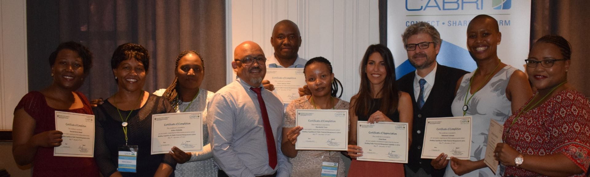 Matt Andrews with CABRI participants showing their Harvard certificates