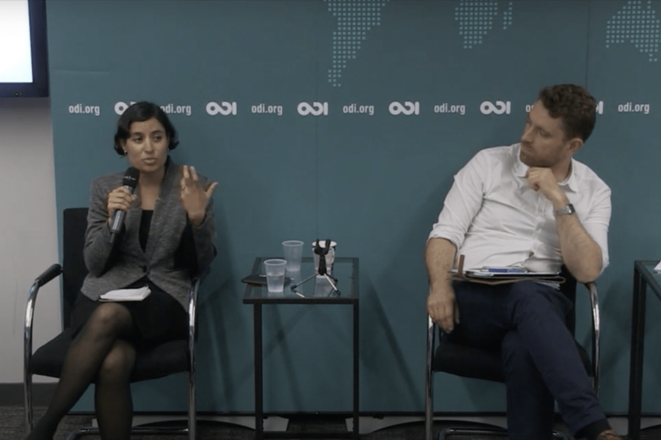 Salimah Samji and Peter Harrington sitting and speaking on a panel with ODI logo behind them