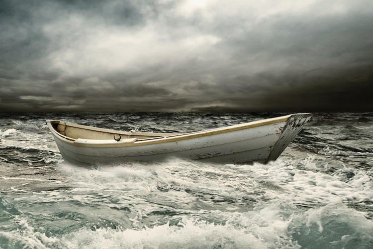 Canoe in stormy waters
