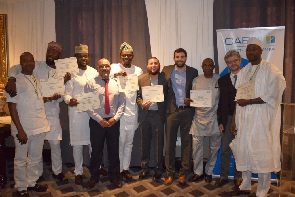 2017 Nigerian team holding certificates with Matt Andrews and Tim McNaught