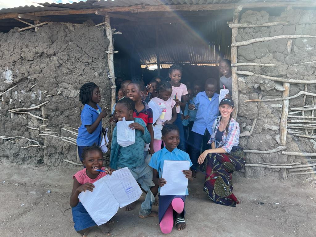 Cara Myers with students in Mozamqiue
