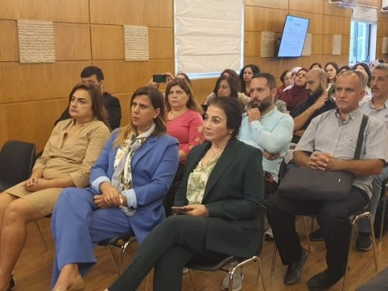 Group of people listening to a presentation