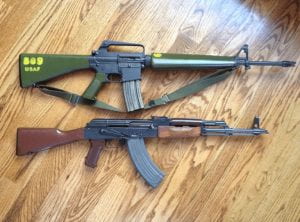 a photograph of two guns on the floor