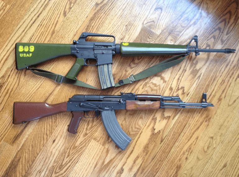 a photograph of two guns on the floor