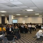 Team presentations in conference room