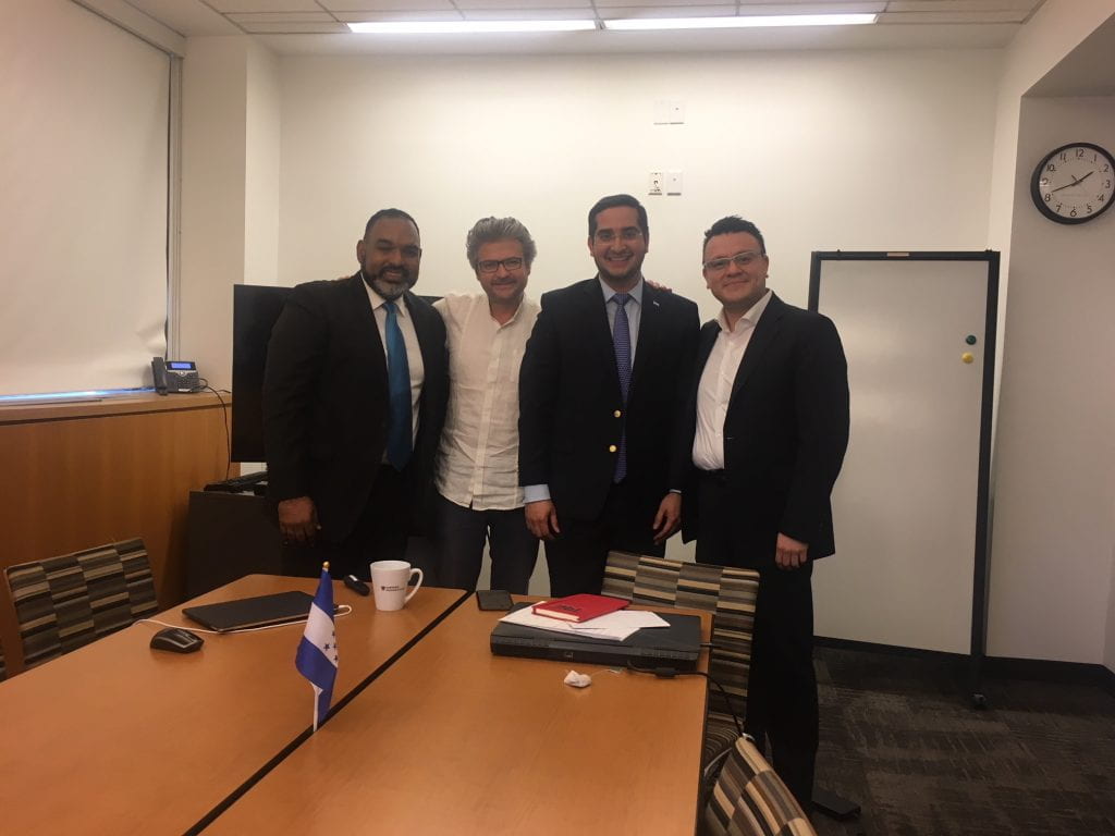a group photograph in a meeting room