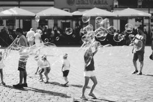 Children playing with bubbles
