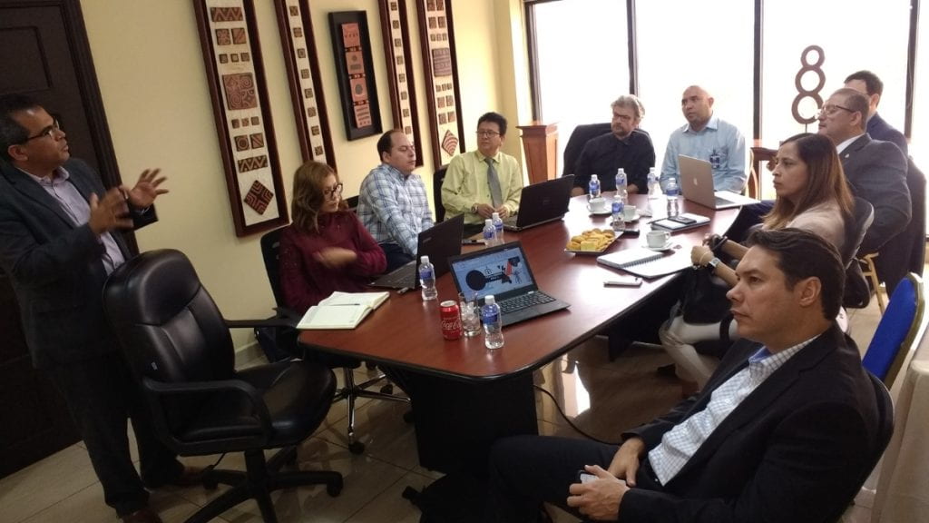 A roundtable of Honduras participants listening to presenter