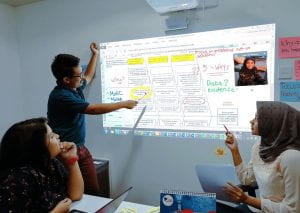 Team collaborating on fishbone diagram