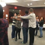 Participants hugging each other