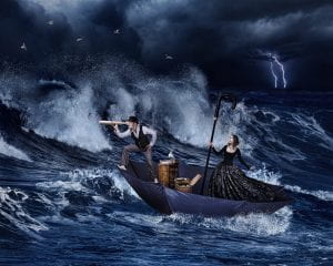 an image of a man and a woman onto a boat and the man is looking out into the sea