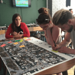 Team looking at a print of a street