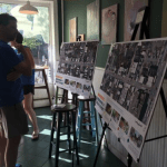 People looking at posters of streetview