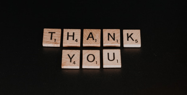 Scrabble pieces saying "Thank you"