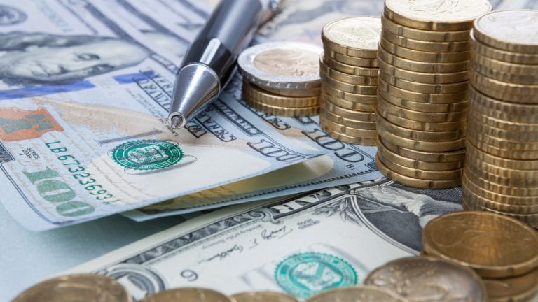 Decorative: Dollar and Euro with pen for managing finances