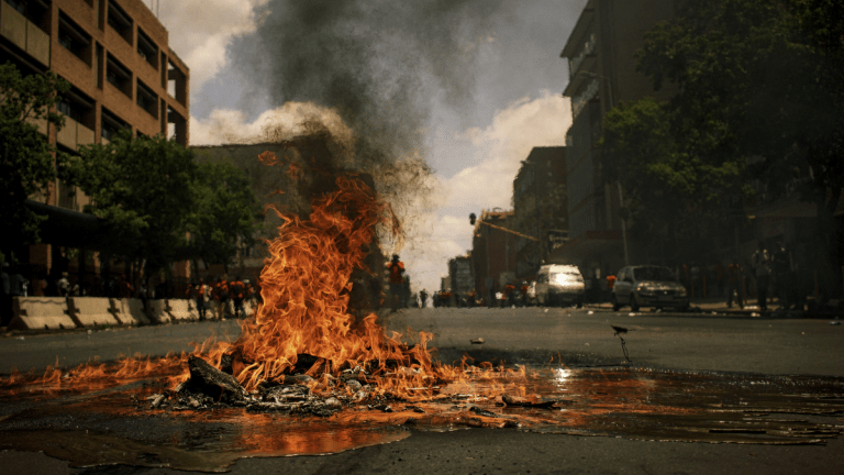 A fire burning in the middle of the street in South Africa