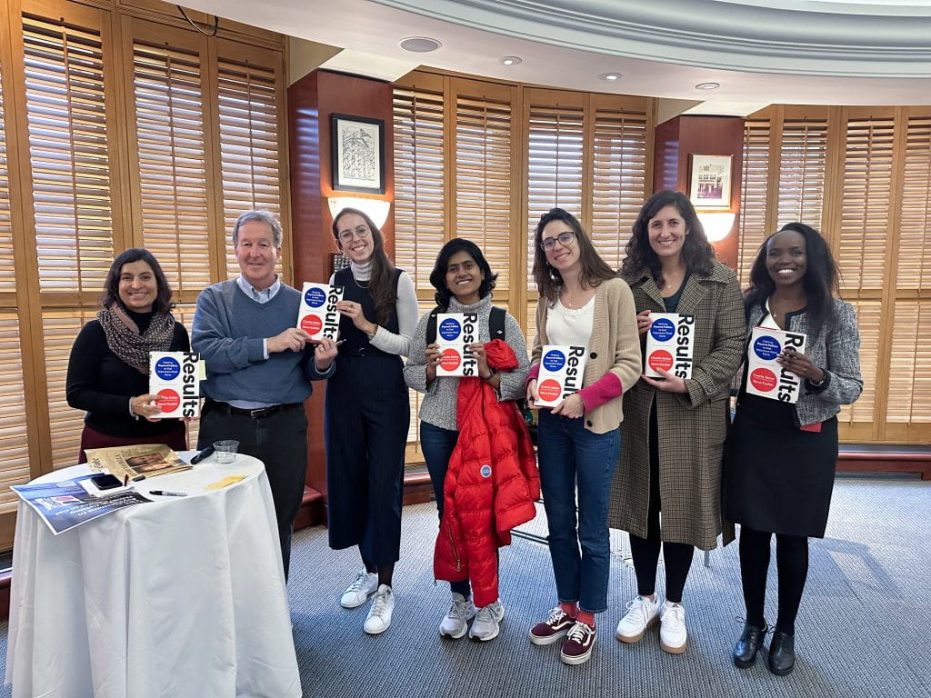 Steve Kadish with students holding his book