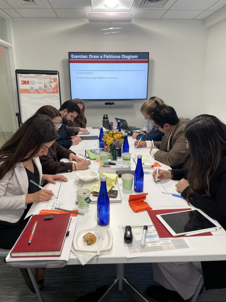 Bloomberg Harvard City Hall Fellows drawing fishbone diagrams