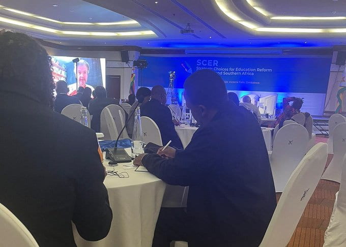 Participants taking notes at SCER event