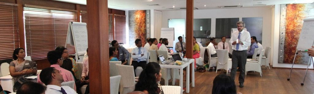 Matt Andrews presenting in conference room in Sri Lanka