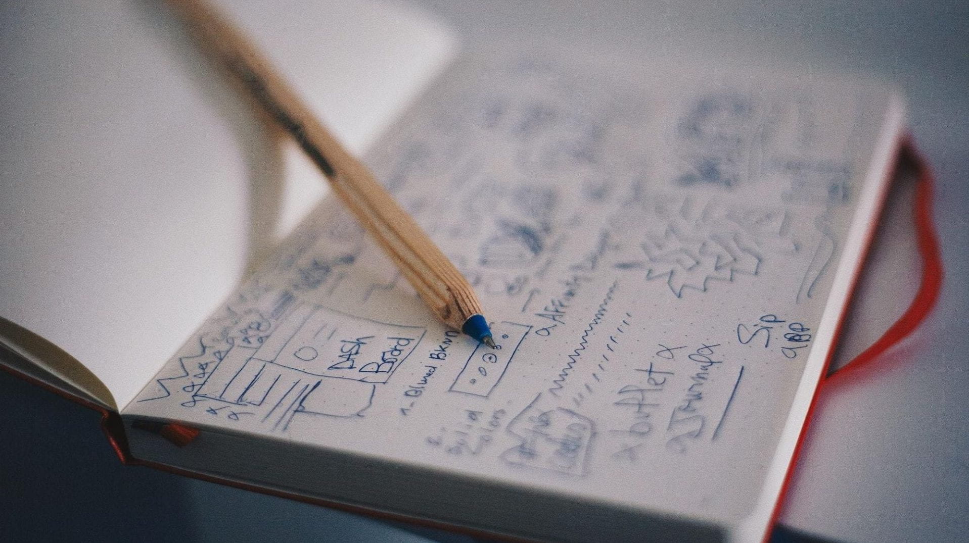 A pencil on a journal with notes