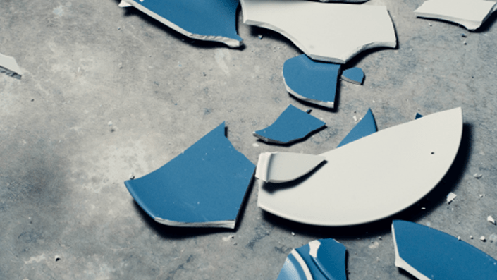 A broken plate on the ground