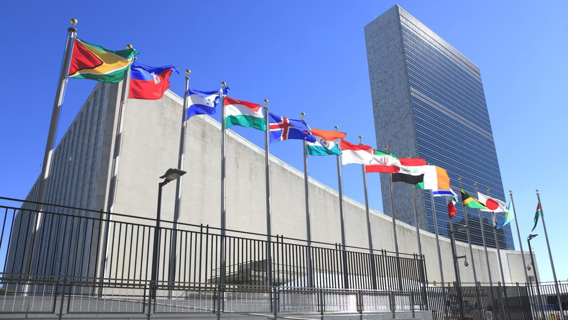 A building with flags from all over the world flying in front