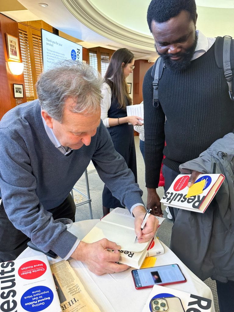 Steve Kadish signing his new book for a student