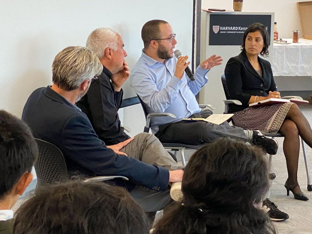 Matt Andrews, Lant Pritchett, Dan Honig (speaking with microphone), and Salimah Samji presenting