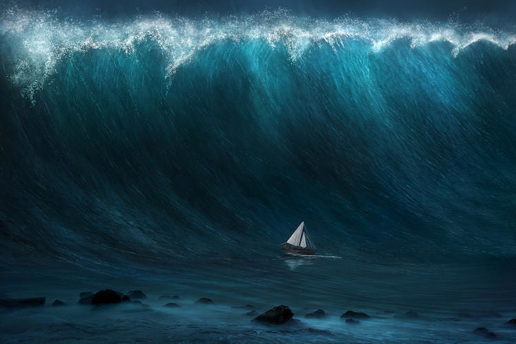A small sailboat that's about to get engulfed by a huge cresting wave