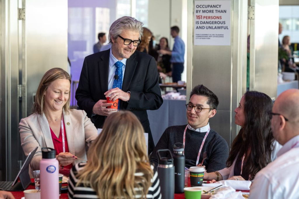 Matt Andrews smiling with Bloomberg participants