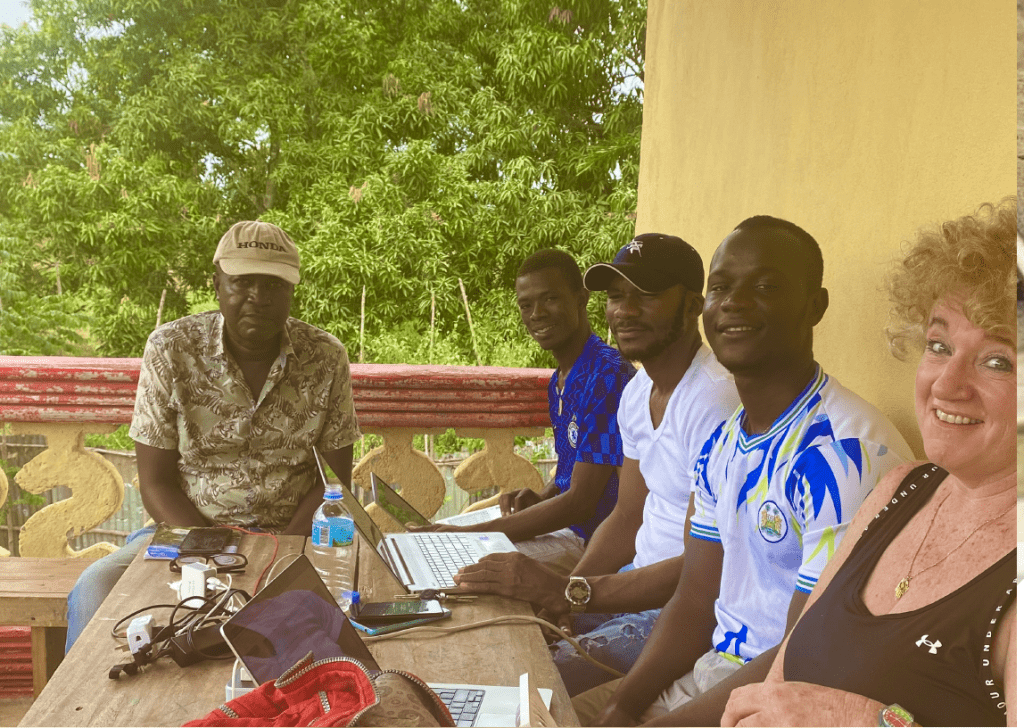 Sierra Leone group team photo, seated and smiling