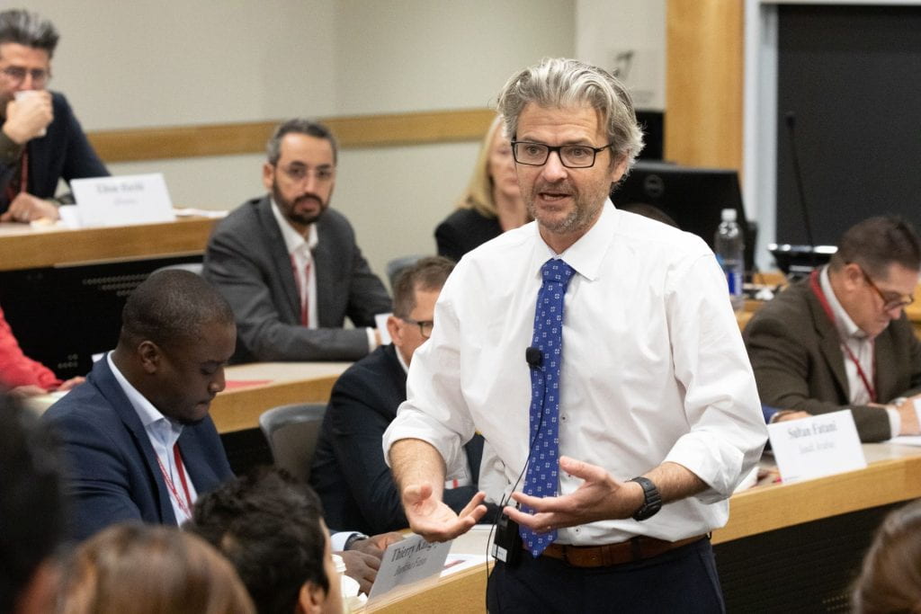Matt Andrews teaching with Executive Education students in the background