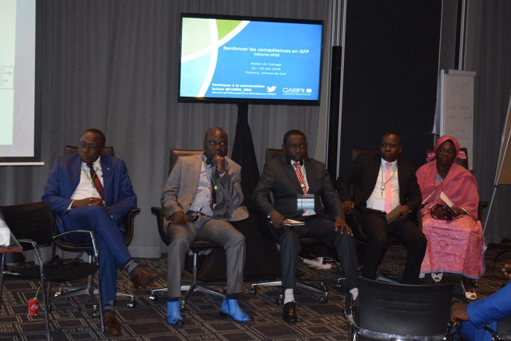 Central African Republic team seated in the front of the room