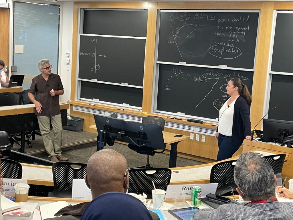 Matt Andrews and Ivana standing in front of an Executive Education classroom