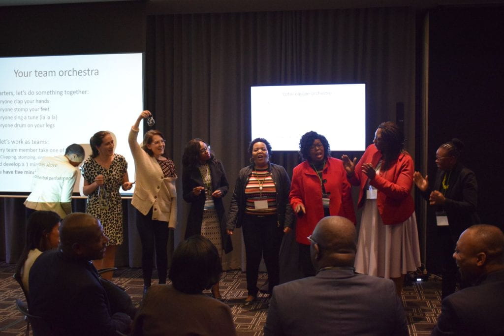 Lesotho team presenting and laughing