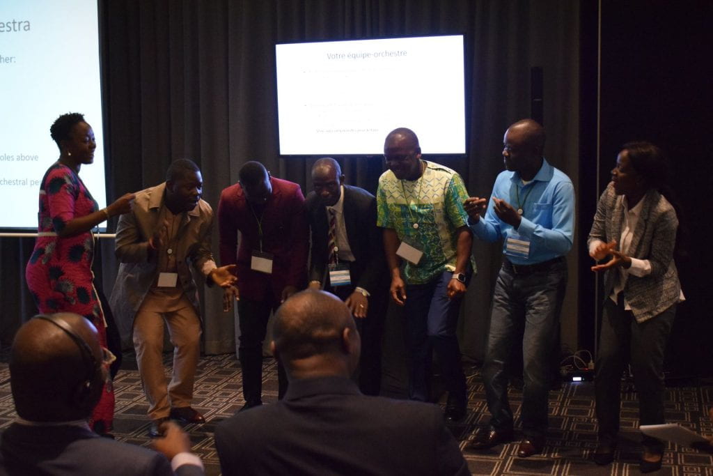 Liberia team dancing during presentation