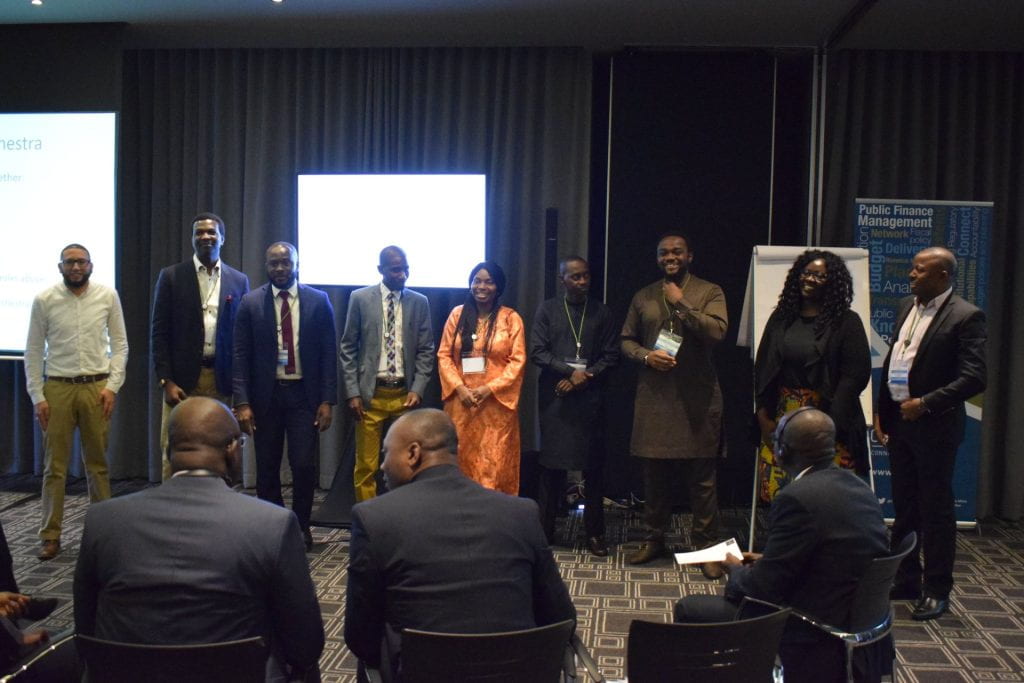 Nigeria team standing in the front of the room presenting