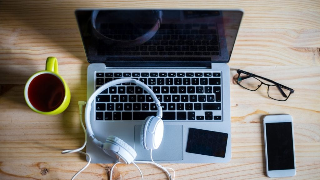 Laptop with phone and headphones