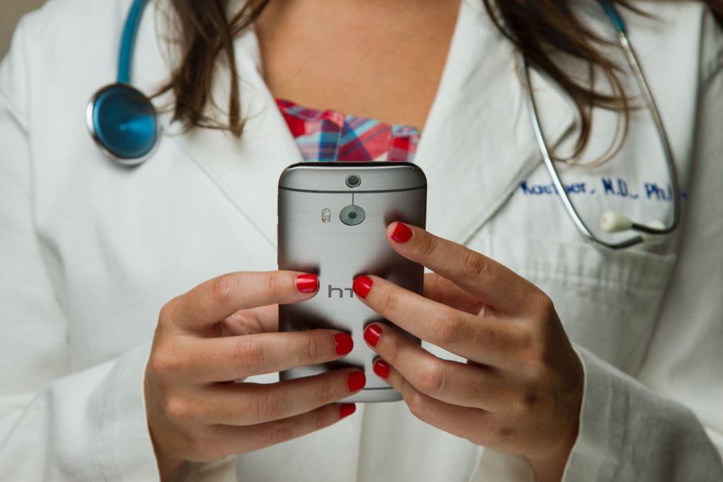 Doctor holding cell phone