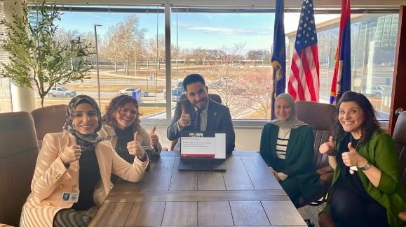 Dearborn Michigan team smiling and giving thumbs up