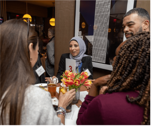 Dearborn team member socializing with other students at an event