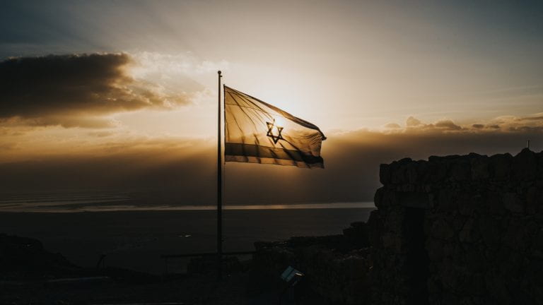 Flag of Israel at sunset