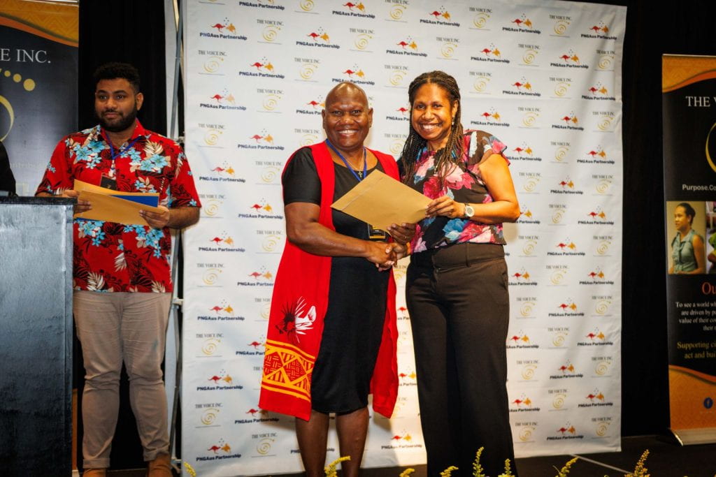A participant receiving their certificate