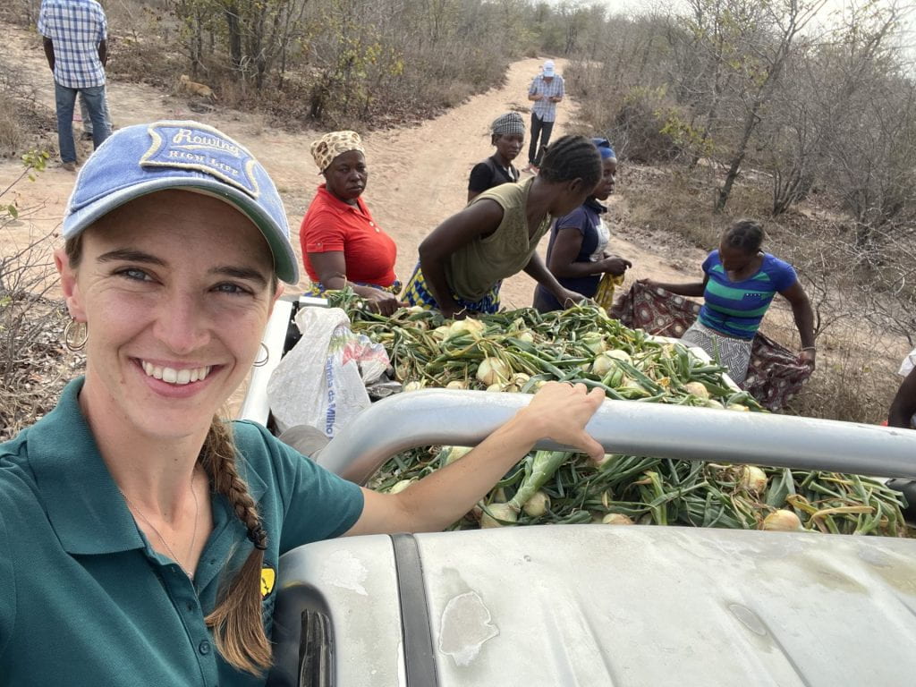 Cara Myers with colleagues collecting food