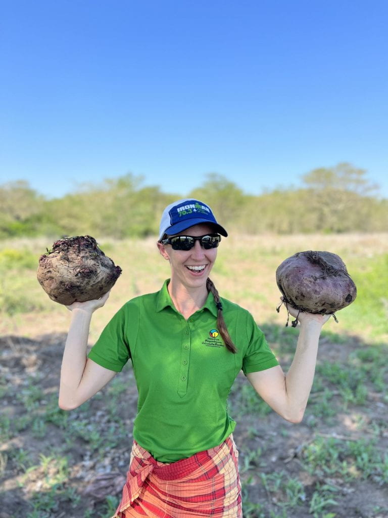 Cara Myers holding beets locally grown